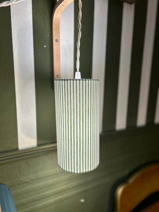 Lampe baladeuse forme tube, rayée